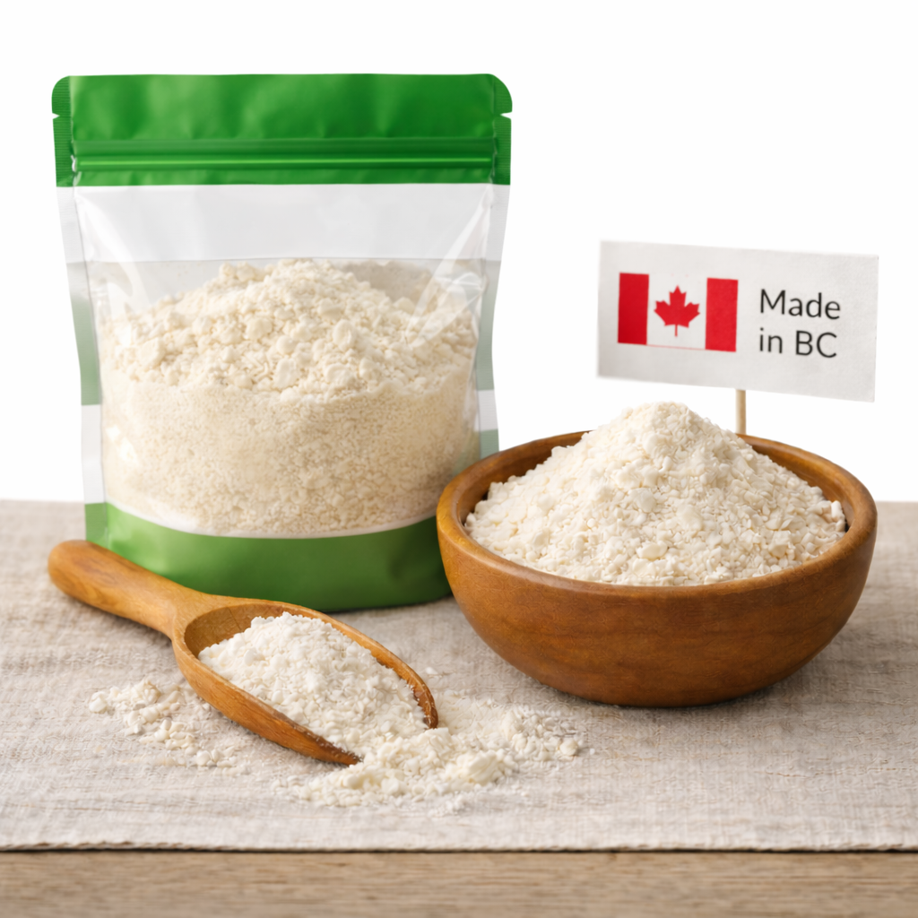ingredients list, protein powder Whey protein isolate 90 percent made in BC displayed in a green and white protein bag with wooden bowl on a neutral background.